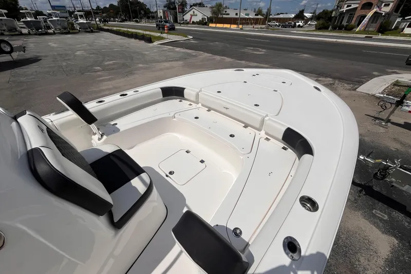 Slide: The Image of 2021 Tidewater 2500 Carolina Bay boat interior with seating and storage compartments. - 9