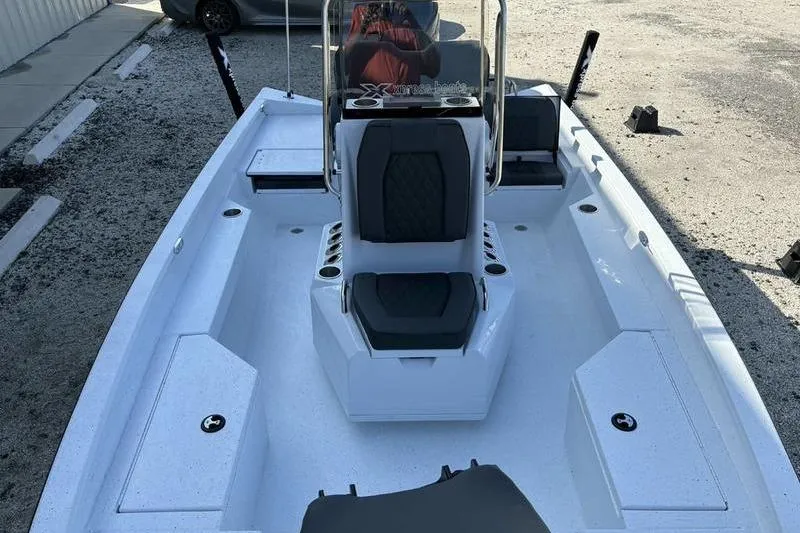 Slide: The Image of 2026 Xpress H20B Bay boat interior with seating and storage compartments. - 11