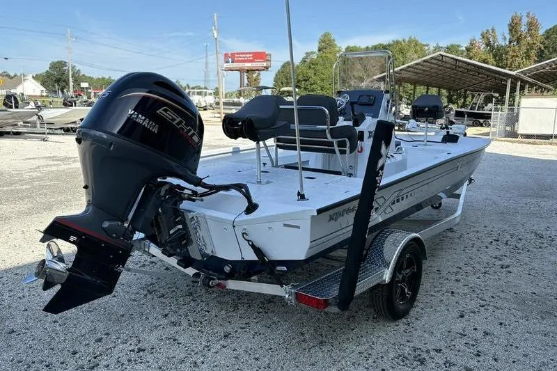 Slide: The Image of 2026 Xpress H20B Bay boat with Yamaha engine on trailer in outdoor setting. - 13