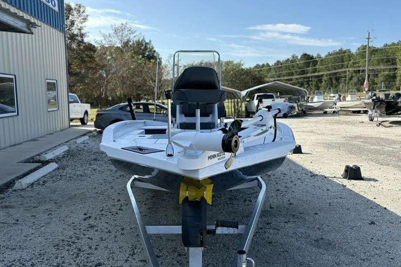 Slide: The Image of 2026 Xpress H20B Bay boat on trailer in outdoor dealership lot. - 4