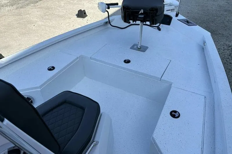 Slide: The Image of 2026 Xpress H20B Bay boat interior with seating and storage compartments. - 6