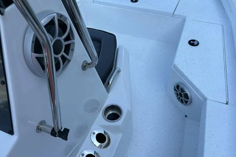 Slide: The Image of 2026 Xpress H20B Bay boat interior with speakers and cup holders. - 8