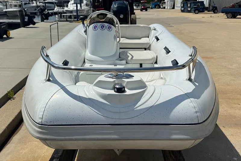 Slide: The Image of 2017 Mercury Inflatables M 400 HP boat docked at marina. - 2