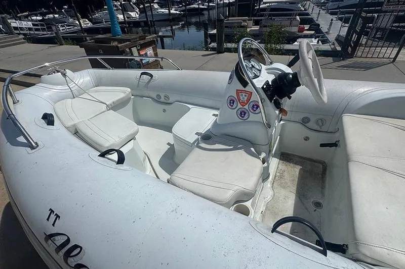 Slide: The Image of 2017 Mercury Inflatables M 400 HP boat interior at marina dock. - 7