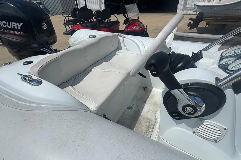 Slide: The Image of 2017 Mercury Inflatables M 400 HP boat interior with steering wheel and seating. - 9