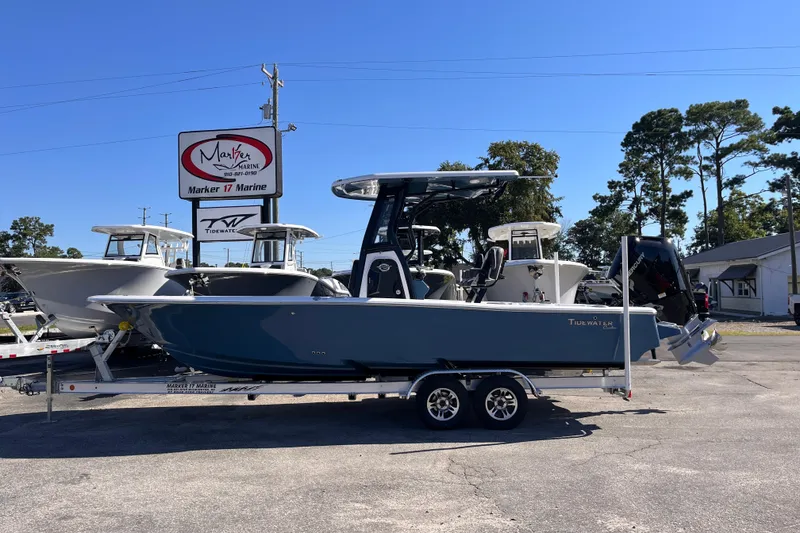 Slide: The Image of 2026 Tidewater 2500 Carolina Bay boat on trailer at Marker 17 Marine dealership. - 0