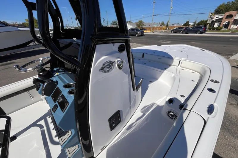 Slide: The Image of 2026 Tidewater 2500 Carolina Bay boat interior with console and seating area. - 10