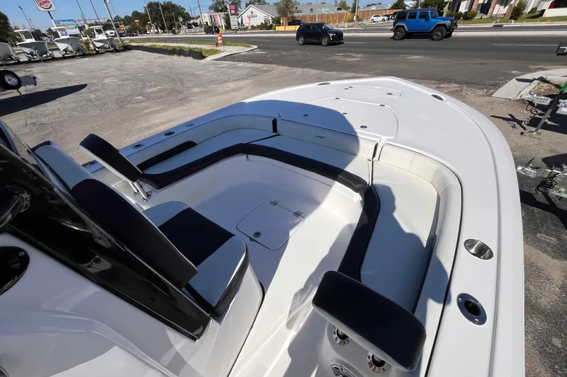 Slide: The Image of 2026 Tidewater 2500 Carolina Bay boat interior with seating and storage compartments. - 12