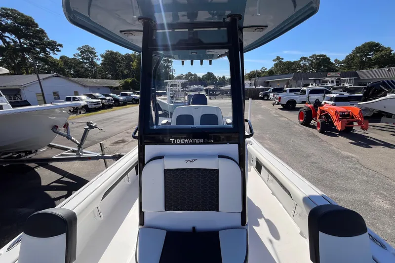 Slide: The Image of 2026 Tidewater 2500 Carolina Bay boat at dealership, showcasing interior and console design. - 13