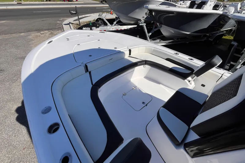 Slide: The Image of 2026 Tidewater 2500 Carolina Bay boat interior with seating and storage compartments. - 14