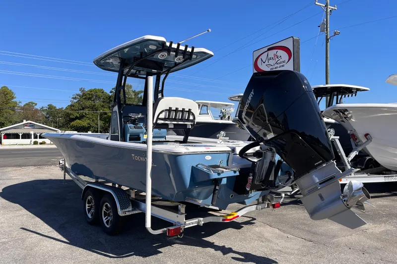 Slide: The Image of 2026 Tidewater 2500 Carolina Bay boat with Mercury engine on trailer. - 2
