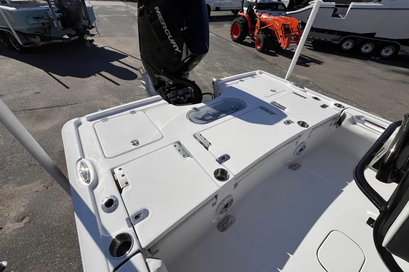 Slide: The Image of 2026 Tidewater 2500 Carolina Bay boat with Mercury engine, featuring spacious deck layout. - 5