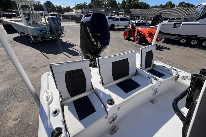 Slide: The Image of 2026 Tidewater 2500 Carolina Bay boat with Mercury engine, featuring sleek seating and modern design. - 7