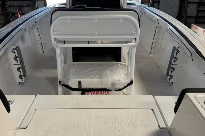 Slide: The Image of 2024 Yamaha Boats 252 FSH Sport interior with seating and storage features. - 3