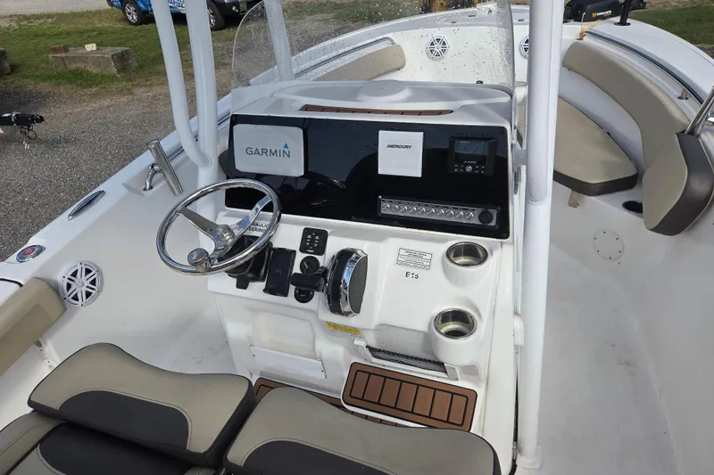 Slide: The Image of 2021 Tidewater 220 LXF boat console with Garmin navigation and Mercury controls. - 13