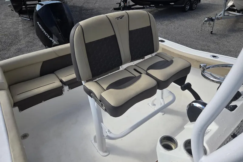 Slide: The Image of 2021 Tidewater 220 LXF boat interior with dual seats and steering console. - 15