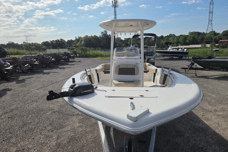 Slide: The Image of 2021 Tidewater 220 LXF boat with Minn Kota motor in outdoor setting. - 7