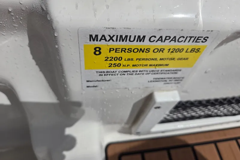 Slide: The Image of 2021 Tidewater 220 LXF capacity label: 8 persons, 1200 lbs, 250 HP motor max. - 9