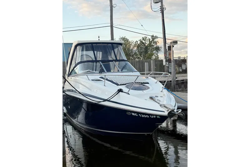 Slide: The Image of 2018 Regal 28 Express boat docked, featuring sleek design and modern amenities. - 3