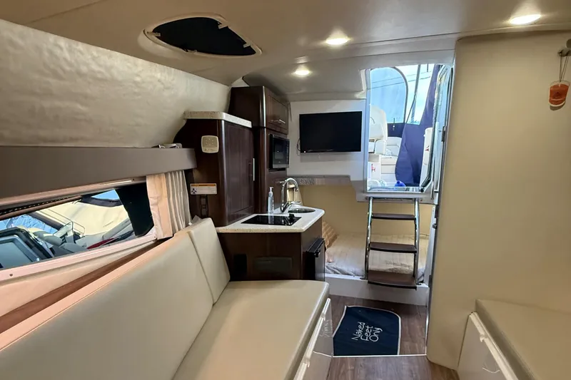 Slide: The Image of Interior of 2018 Regal 28 Express boat with modern amenities and cozy seating. - 31