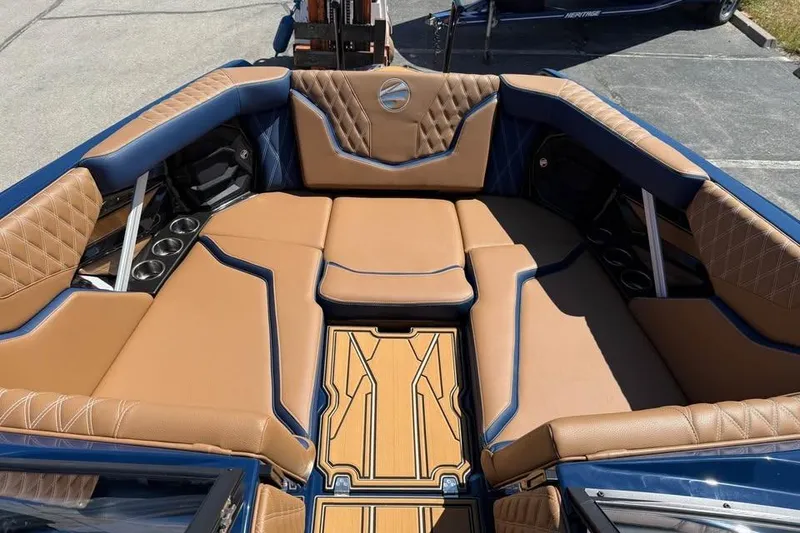 Slide: The Image of Luxurious interior of 2026 Tigé 24RZX boat with tan and blue seating. - 14