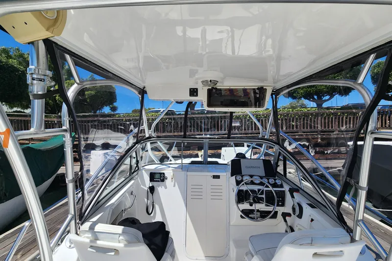 Slide: The Image of Interior view of a 2000 Boston Whaler 21 Conquest boat with Garmin navigation system. - 14