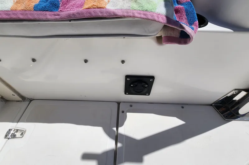 Slide: The Image of Interior of a 2000 Boston Whaler 21 Conquest boat with colorful towel. - 16