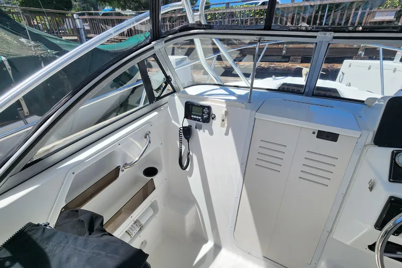Slide: The Image of Interior view of a 2000 Boston Whaler 21 Conquest boat cockpit. - 9