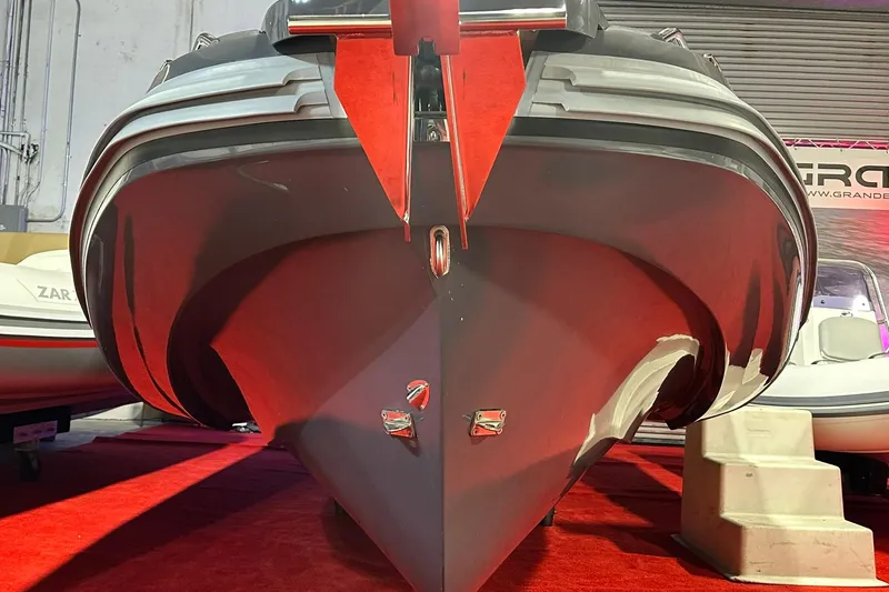 Slide: The Image of Front view of 2025 Zar Formenti 59 SL/Limited boat on display indoors. - 10