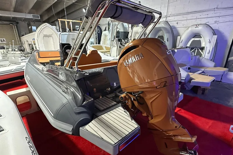 Slide: The Image of 2025 Zar Formenti 59 SL/Limited boat with Yamaha outboard motor in showroom. - 2