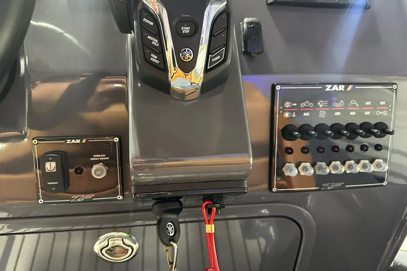 Slide: The Image of Control panel of 2025 Zar Formenti 59 SL/Limited boat with switches and key. - 5