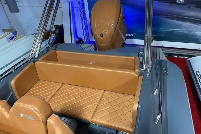 Slide: The Image of 2025 Zar Formenti 59 SL/Limited boat interior with tan quilted seating and sleek design. - 6