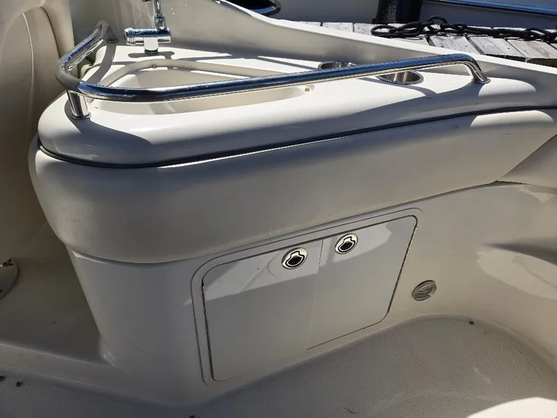 Slide: The Image of 2008 Sea Ray 240 Sundeck interior with sink and storage compartment. - 10