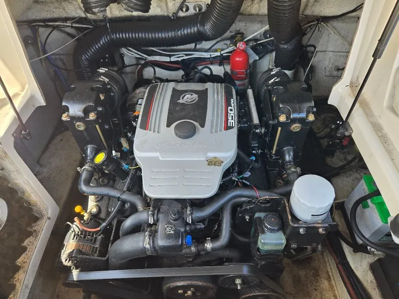 Slide: The Image of Engine compartment of a 2008 Sea Ray 240 Sundeck boat, featuring a 350 MAG engine. - 14