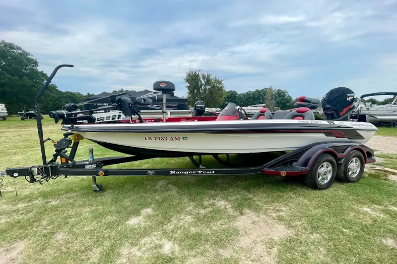 The Image of 2008 Ranger 520VX boat on trailer, parked on grass, with overcast sky background. - 0