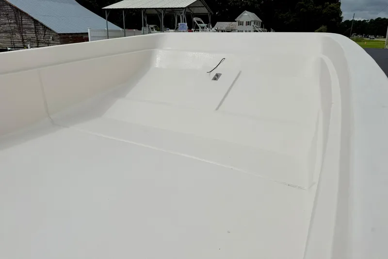 Slide: The Image of 2026 Carolina Skiff E21 DLX Kit Boat deck, showcasing spacious and sleek design. - 10