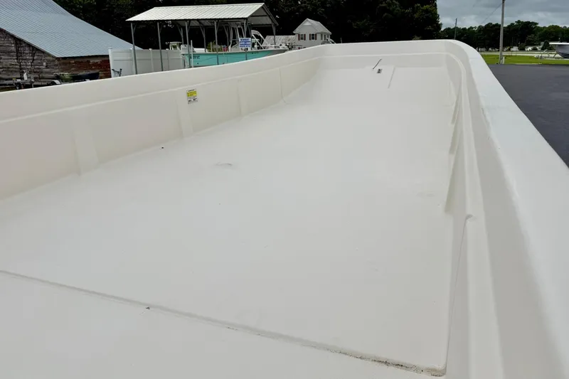 Slide: The Image of 2026 Carolina Skiff E21 DLX Kit Boat hull, showcasing spacious interior design. - 13