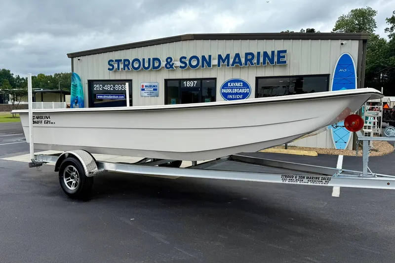 Slide: The Image of 2026 Carolina Skiff E21 DLX Kit Boat on trailer at Stroud & Son Marine. - 6