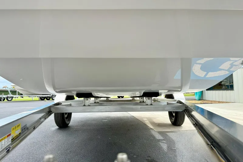 Slide: The Image of 2026 Carolina Skiff E21 DLX Kit Boat on trailer, viewed from below. - 8