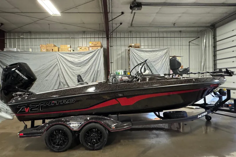 Slide: The Image of 2024 Nitro ZV21 boat in a garage, featuring sleek design and modern equipment. - 0