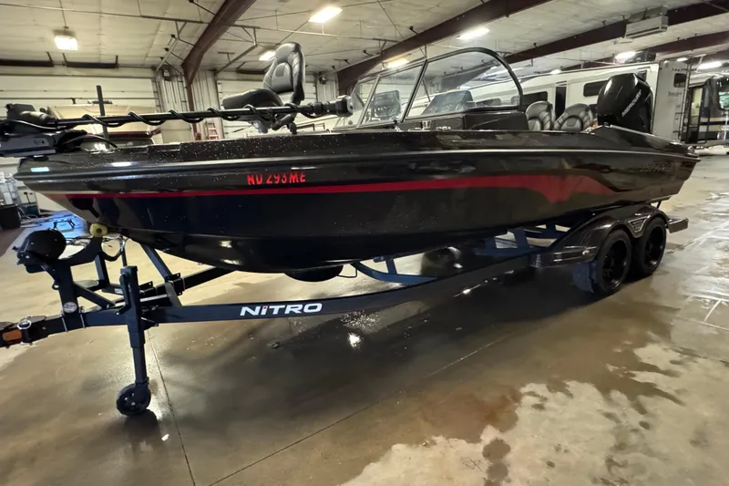 Slide: The Image of 2024 Nitro ZV21 boat on trailer in indoor storage facility. - 1