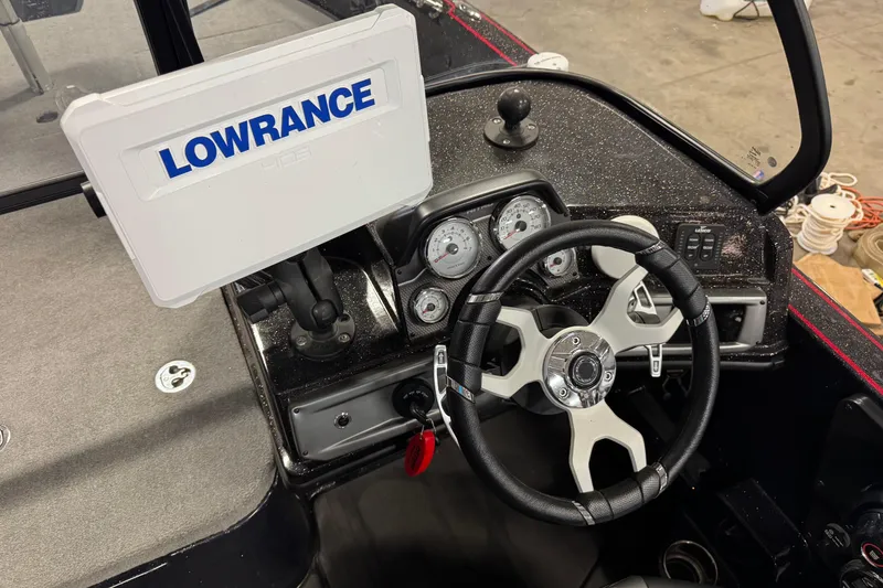 Slide: The Image of 2024 Nitro ZV21 boat dashboard with Lowrance HDS display and modern steering wheel. - 10