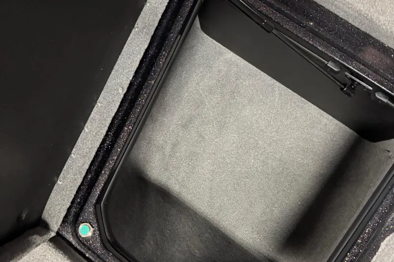 Slide: The Image of 2024 Nitro ZV21 storage compartment with carpeted interior and secure lid. - 16