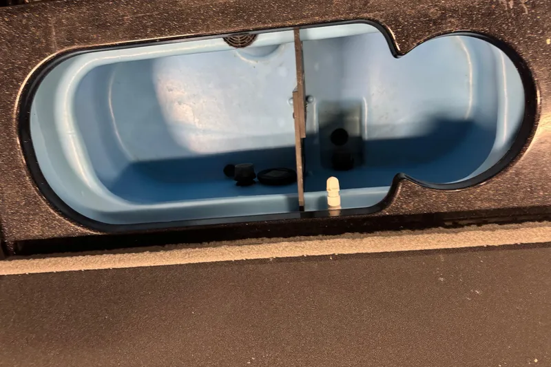 Slide: The Image of 2024 Nitro ZV21 livewell interior with blue lining and drainage system. - 20