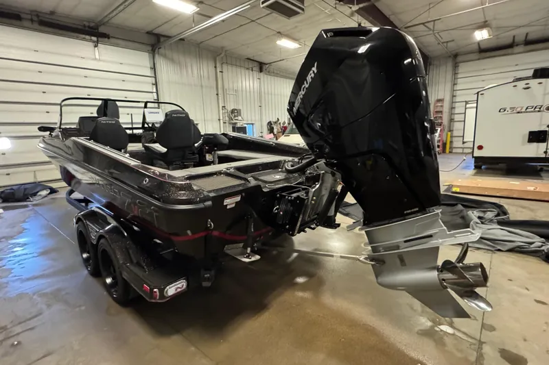 Slide: The Image of 2024 Nitro ZV21 boat with Mercury engine in a garage setting. - 4