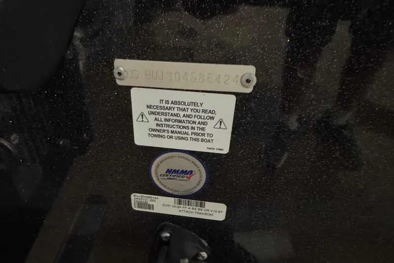 Slide: The Image of 2024 Nitro ZV21 boat warning label and certification sticker on dark surface. - 5