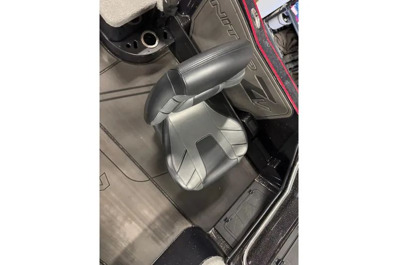 Slide: The Image of 2024 Nitro ZV21 boat interior with sleek black seating and detailed flooring. - 8