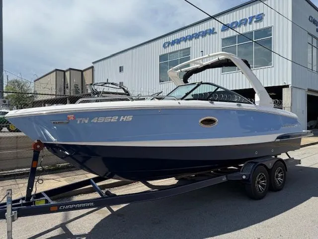 Slide: The Image of 2023 Chaparral 267 SSX boat on trailer outside Chaparral dealership. - 2