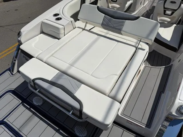 Slide: The Image of 2023 Chaparral 267 SSX boat with luxurious white seating and sleek design. - 29
