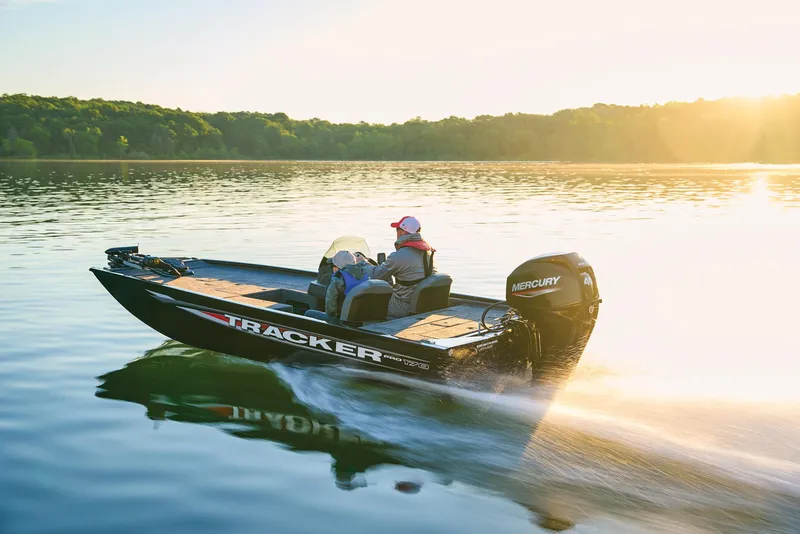 Slide: The Image of Manufacturer Provided Image: 2026 Tracker Pro 170 boat cruising on a serene lake at sunset. - 49